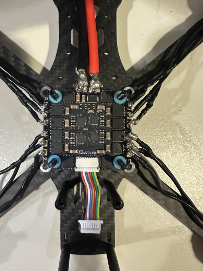 Custom FPV drone on a carbon-fibre frame
